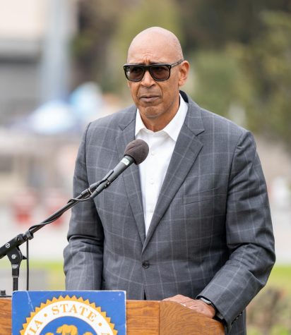Assembly Member Chris Holden takes questions from the podium as he explains his new bill at the Rose Bowl Stadium in Pasadena, Calif. on Thursday, Jan. 19, 2023.