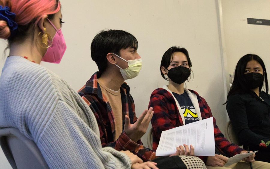 Young group of people with masks talking