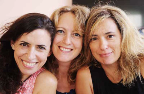 three middle-age women smiling