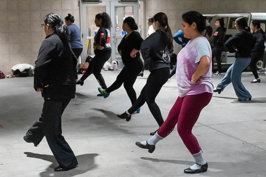 Diana Cabral, the Ballet Folklórico Aztlán de CSUN club advisor, goes through the dance steps with the members of the club during practice on March 3, 2023, outside Sierra Tower in Northridge, Calif.