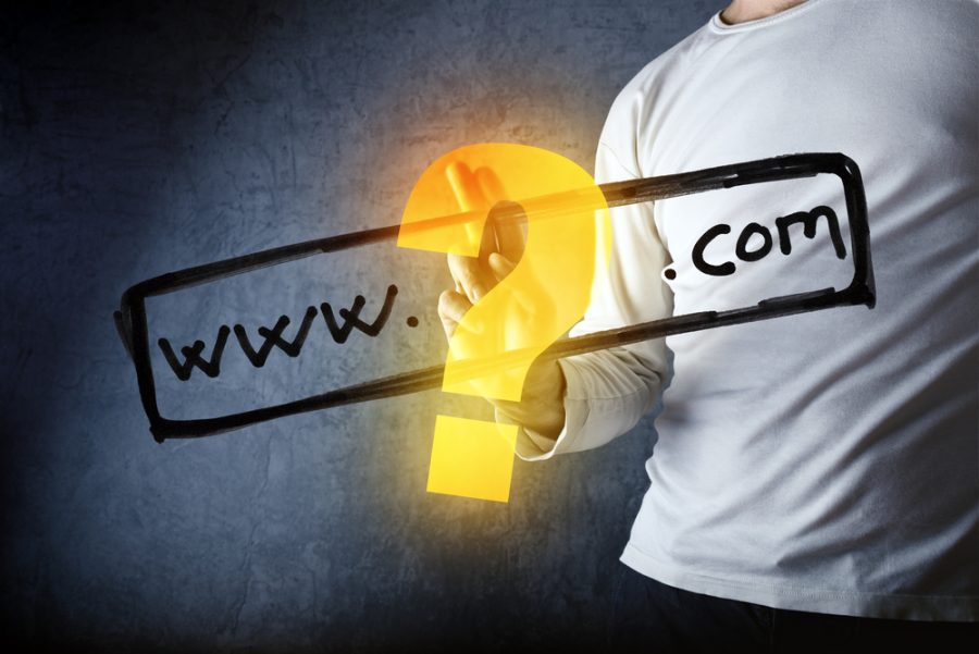 What is your com internet domain, conceptual image with man pushing virtual screen graphics.