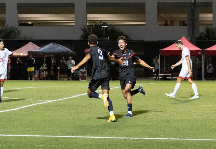 CSUN defender Dylan Gonzalez, 3, and forward David Diaz, 58, celebrate the formers go-ahead goal in the 73rd minute against the Saint Marys College Gaels on Sept. 21, 2022, at the Performance Soccer Field in Northridge, Calif.