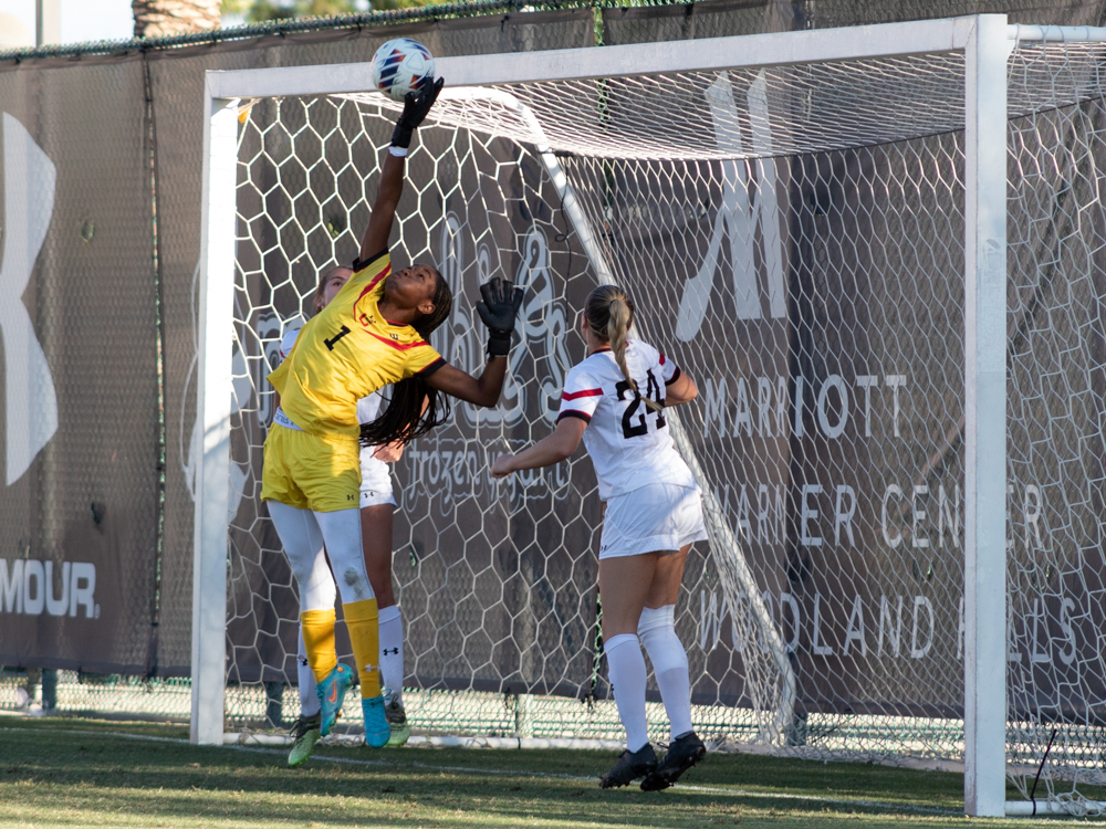 Goalkeeper Taylor Thames jumps up to save the ball from going in the goal against UC San Diego on Sunday, Oct. 23, 2022, at the Performance Soccer Field in Northridge, Calif.