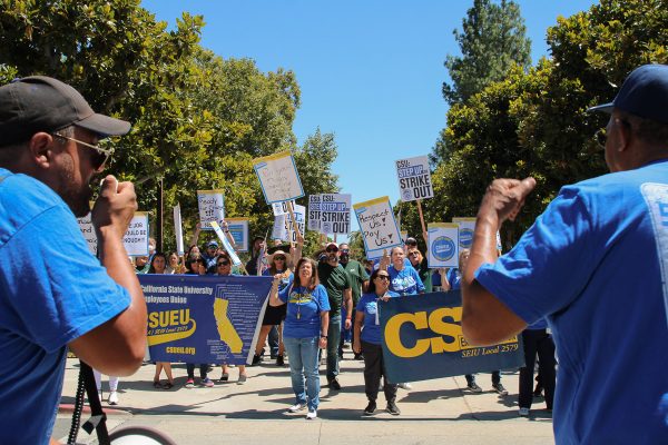 Protestors and speakers in the California State University strike holding up signs at CSUN on Sept. 5 in Northridge, Calif.