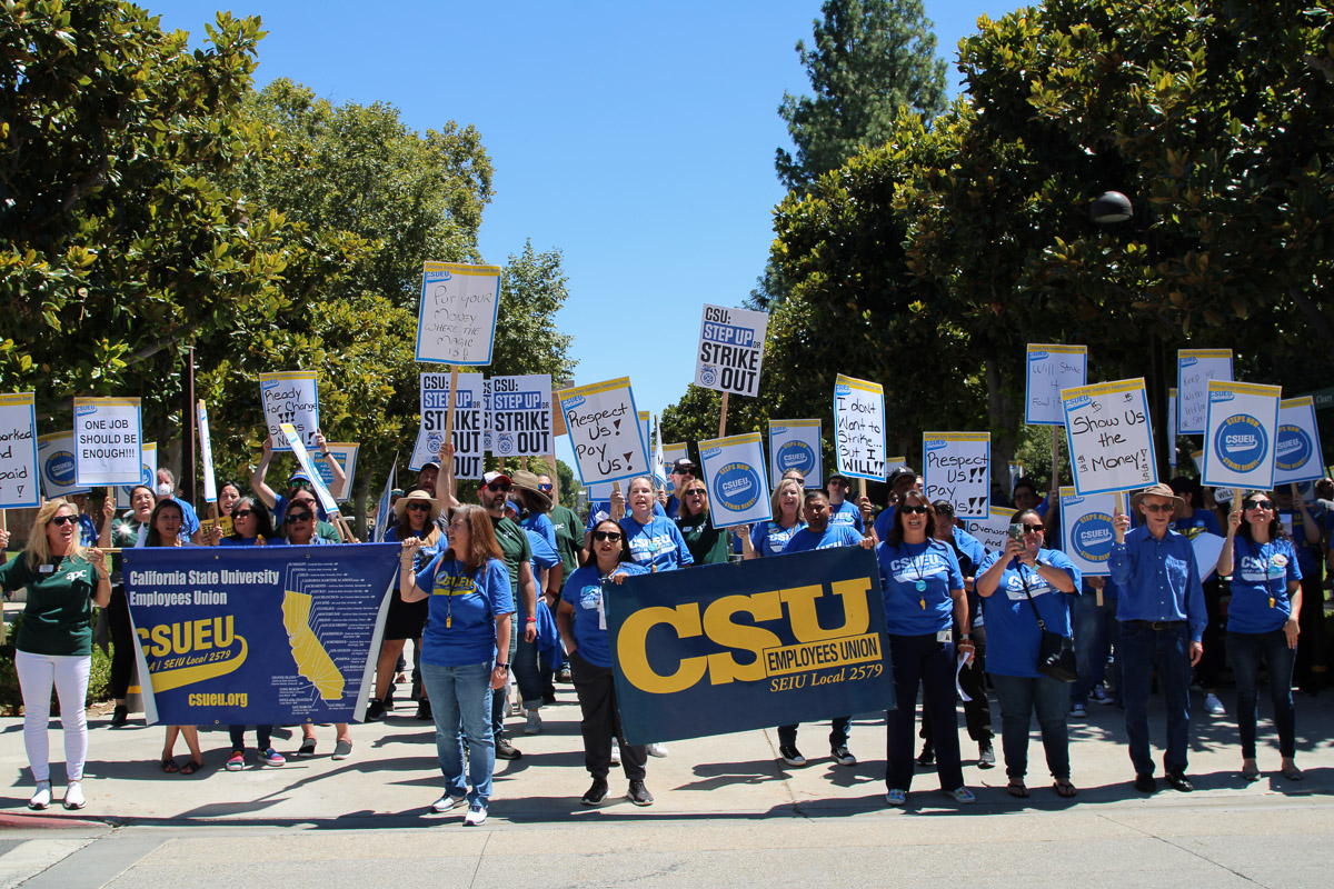 Protestors yelling chants outside of Valera Hall during the California State University strike, holding up signs at CSUN on Sept. 5 in Northridge, Calif.