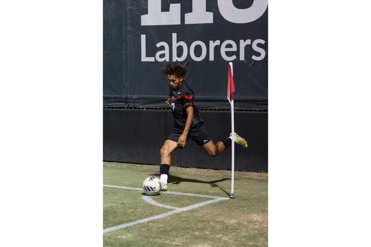 Midfielder Jorge Solorzano, 7, gets a corner kick for the Matadors during the game against the Sacramento State Hornets on Oct. 7, 2023, at the Matador Soccer Field in Northridge, Calif.