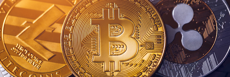 Stack of cryptocurrencies with a golden bitcoin in the middle.