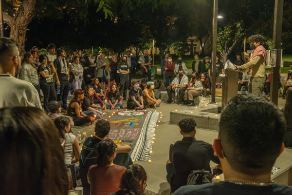 Attendees at the Students for Justice in Palestine vigil listen to a student speak out against the violence towards Palestinians in Gaza at CSUN in Northridge, Calif. on Oct. 19.