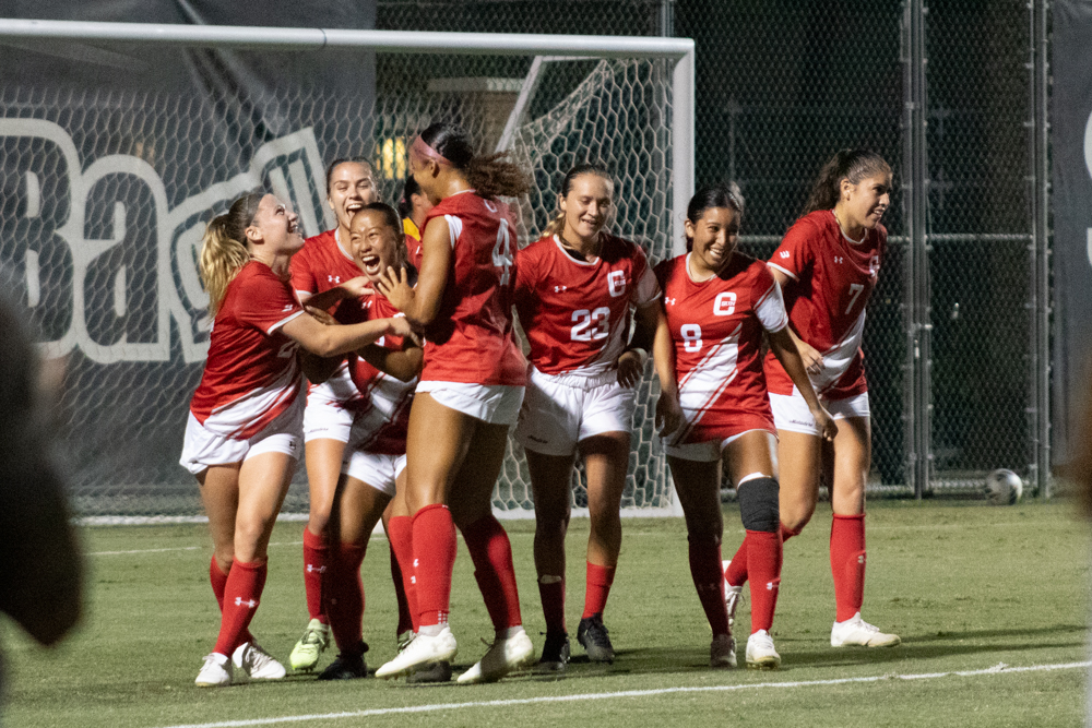 After scoring, forward/midfielder Cassidy Imperial-Pham, 18, celebrates with teammates at Matador Soccer Field in Northridge, Calif., on Sept. 28, 2023.