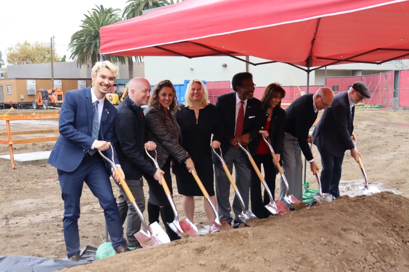 University leaders dig into the ground at the construction site of where the new dorms will be in Northridge, Calif., on Nov. 15, 2023.