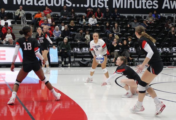 Second from right, CSUN libero Elizabeth Gannon takes a knee to bump the ball as CSUN womens volleyball takes on CSU Fullerton on Saturday, Nov. 12, 2022, at the Premier America Credit Union Arena in Northridge, Calif.