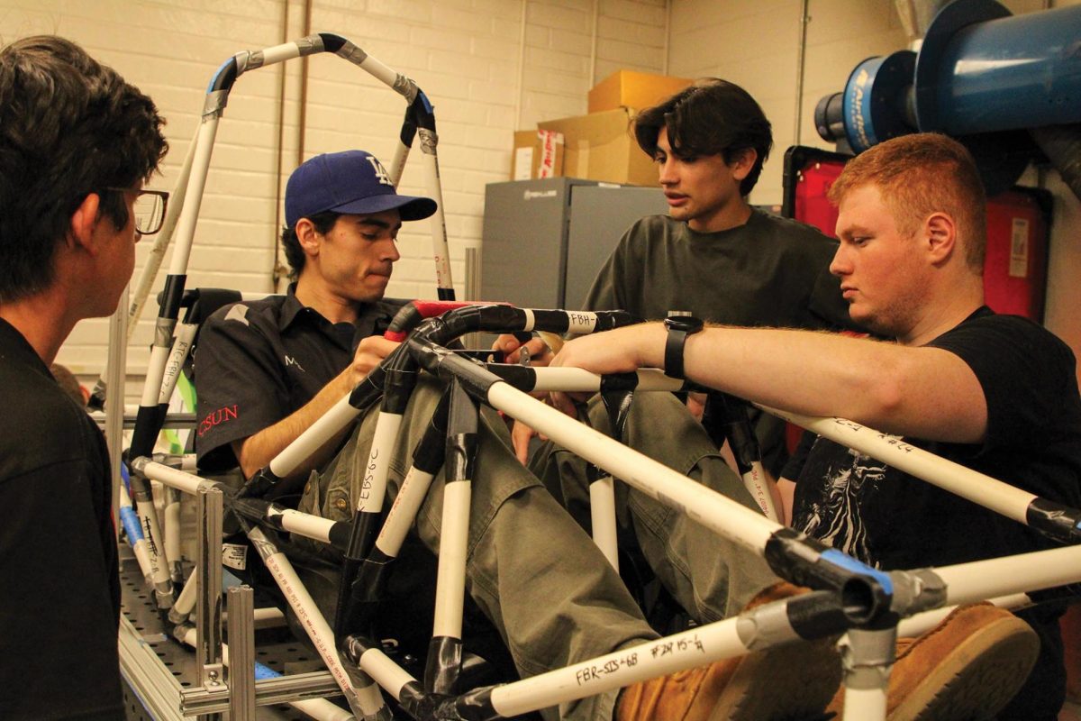 Students from the F1 team work on their car in Northridge, Calif.