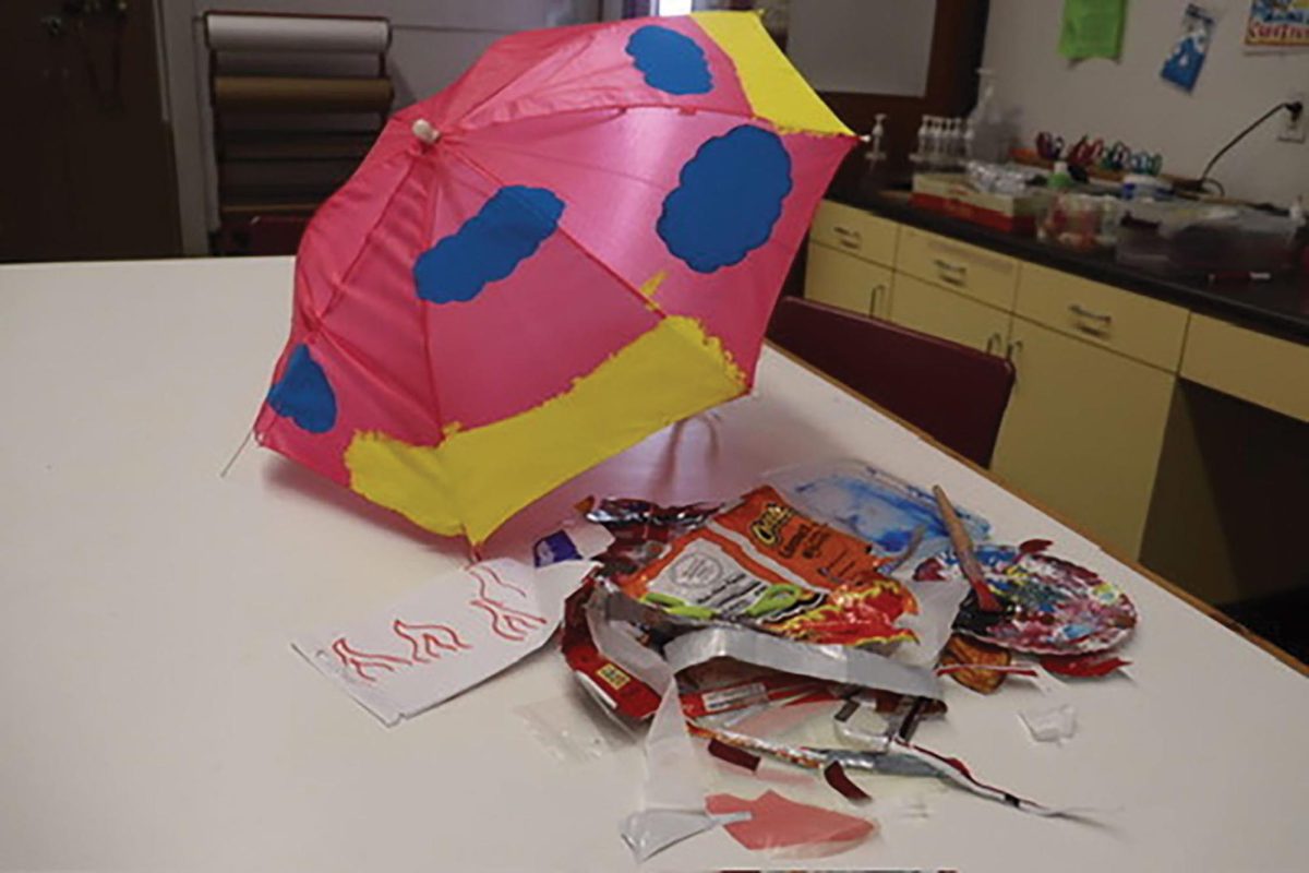 This in-progress umbrella, also by a student of Liu’s, raises awareness for global warming. The umbrella itself is recycled — frayed, but usable — and will be painted and lined with Cheetos bags. The piece is a reminder that without environmental regulations, the snacks will not be all that is “flamin’ hot.”