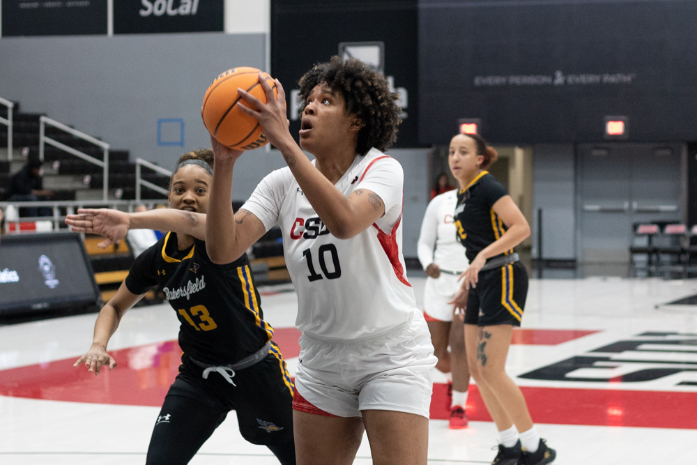 File photo. Forward Ana Carolina De Jesus, 10, pulls the ball up to shoot while CSU Bakersfields center Soli Herrera, 13, tries to defend her on Thursday, Feb. 9, 2023, at the Premier America Credit Union Arena in Northridge, Calif.