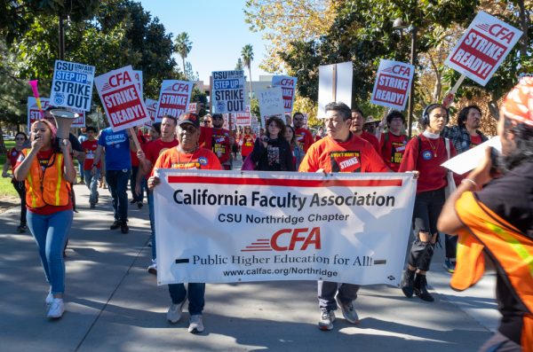 Students, CFA, and CSUEU members march up Cleary Walk towards the library at CSUN on Dec. 5.