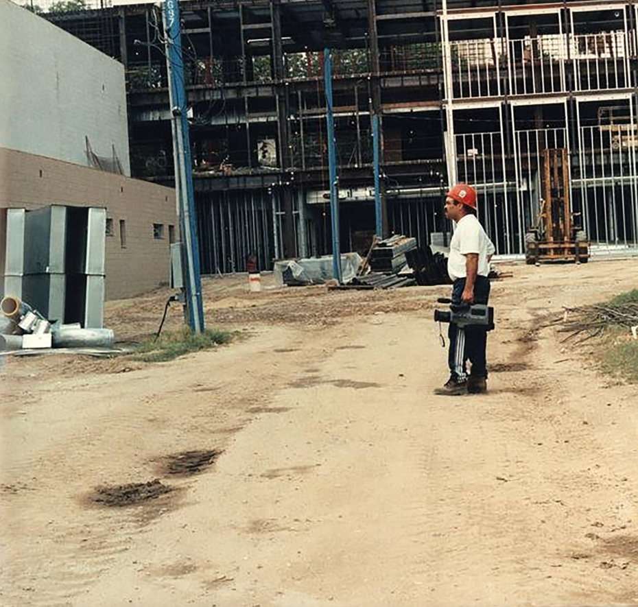 Johnson+looking+at+the+construction+of+Manzanita+Hall+around+1999.+