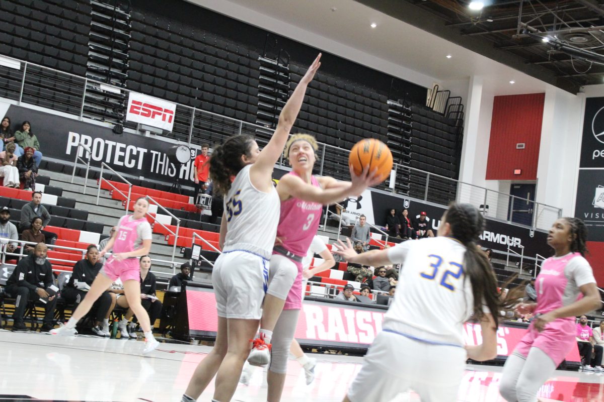 Matadors guard Erica Adams scores the tough contested layup off a defensive stop to cut the lead to 33-31 with under two minutes left in the first half at the Premier Credit Union Area on Jan. 10 in Northridge, Calif.