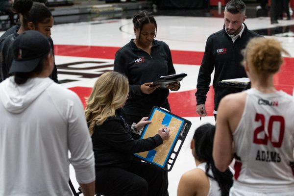 Head coach Carlene Mitchell writes a play down on a dry-erase board during a timeout against Cal State Bakersfield on Thursday, Feb. 15, 2024, at the Premier America Credit Union Arena in Northridge, Calif.