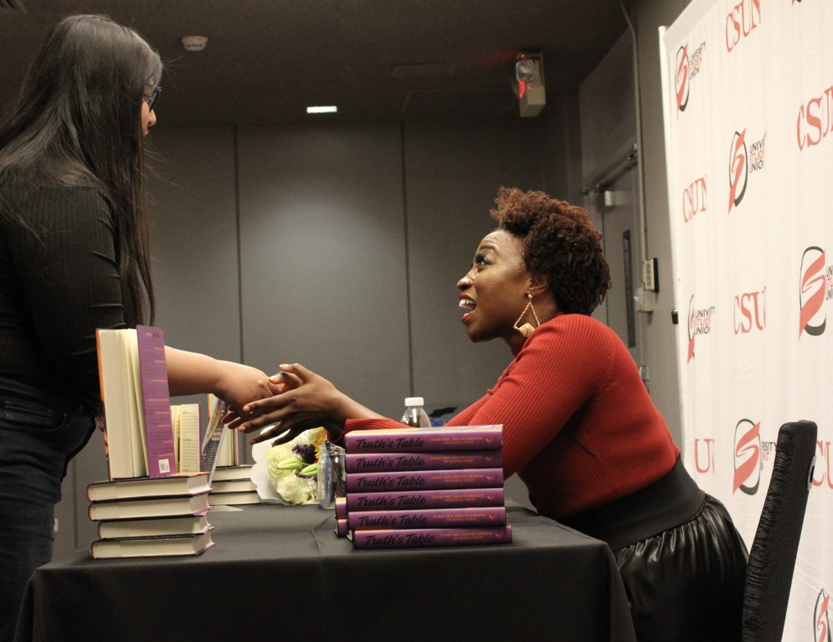 CSUN alumna Ekemini Uwan, co-author for “Truths Table,” during her book signing, after the Essential Talks lecture in the University Student Union in Northridge, Calif. on Thursday, Feb. 22, 2024, Northridge, Calif.