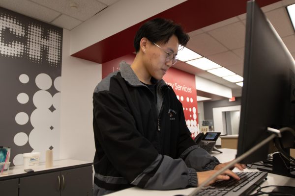 IT help student assistant Ethan Vue working at the IT desk located on the first floor of the CSUN University Library on Thursday, Feb. 29, 2024, in Northridge, Calif.