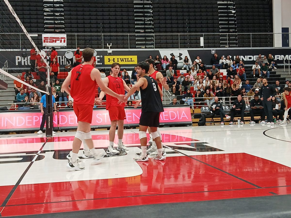 The Matadors huddle after scoring a point against Long Beach State on Saturday, April 6 in Northridge, Calif.