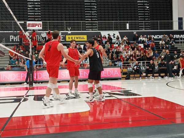 The Matadors huddle after scoring a point against Long Beach State on Saturday, April 6 in Northridge, Calif.