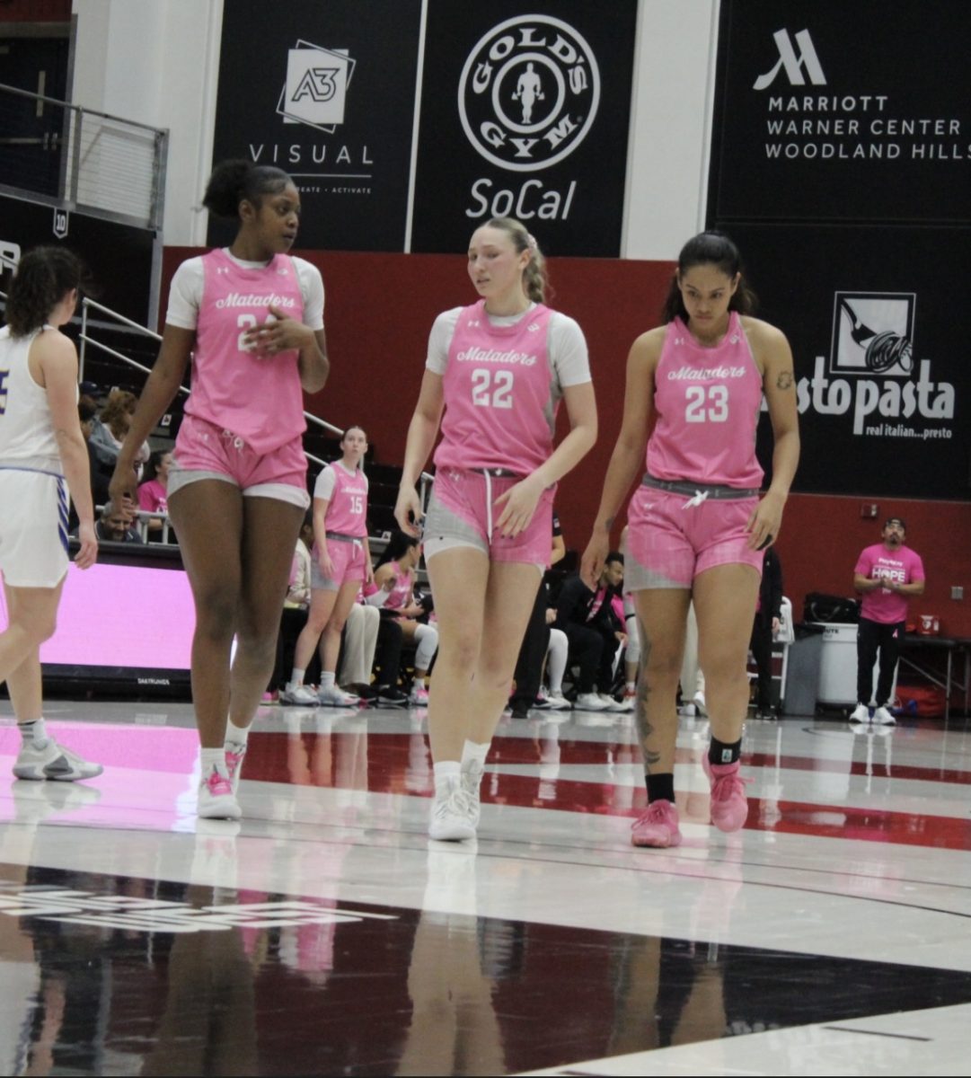 Forward Talo Li-Uperesa, guard Kaitlyn Elsholz and forward Kayanna Spriggs talk about a play that was drawn up after a timeout at the Premier America Credit Union Arena on Jan. 10 in Northridge, Calif.