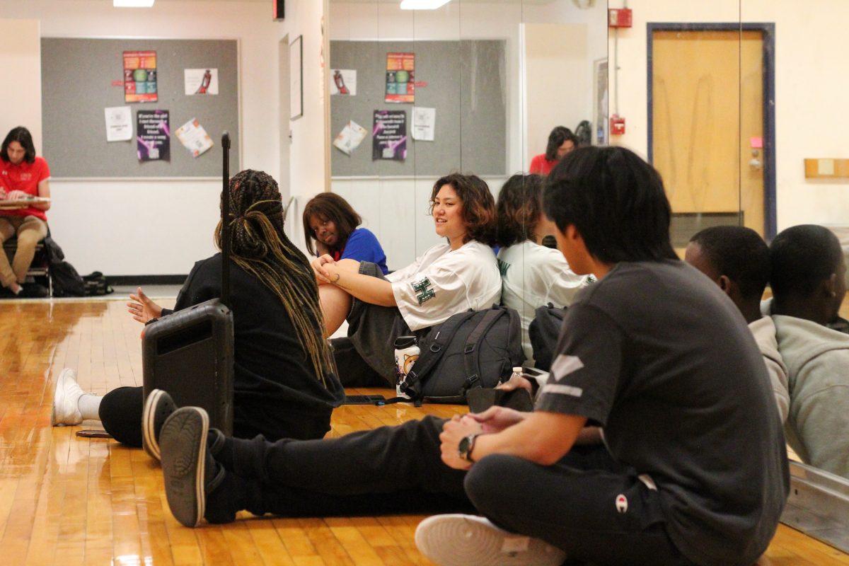 The CSUN Hip Hop dance team takes a break from dancing to discuss what song to perform for their next show during practice on Tuesday, March 12, 2024, in Redwood Hall B1.