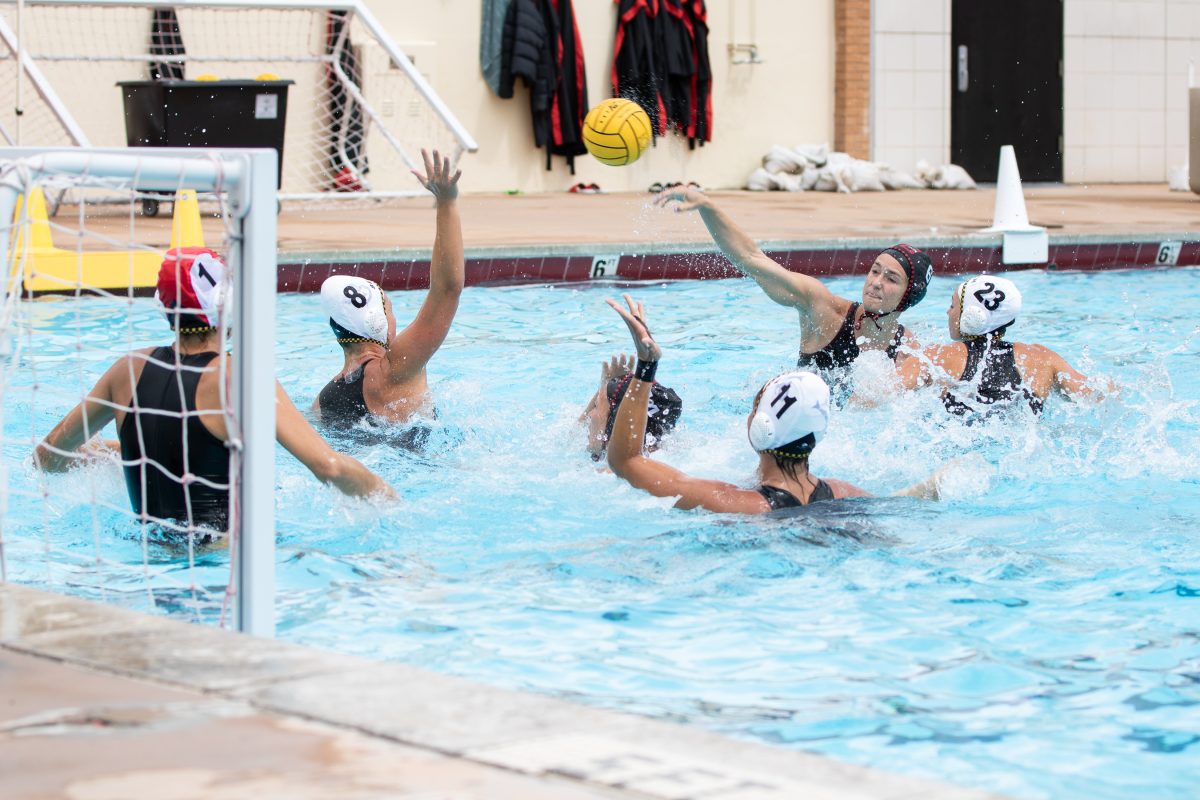 Attacker+Tatiana+Smeltzer%2C+6%2C+throws+the+ball+towards+the+goal+while+being+defended+against+Cal+State+Long+Beach+on+Saturday%2C+March+30%2C+2024%2C+at+the+Matador+Pool+in+Northridge%2C+Calif.