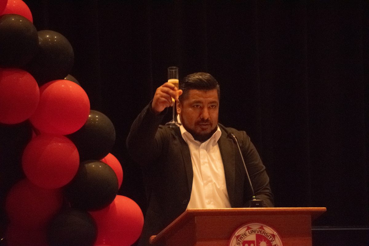 Gabriel Hernandez raises his glass preparing for the toast on stage inside the Northridge Center during the Veteran Graduation on Sunday, May 11, 2024 in Northridge, Calif.