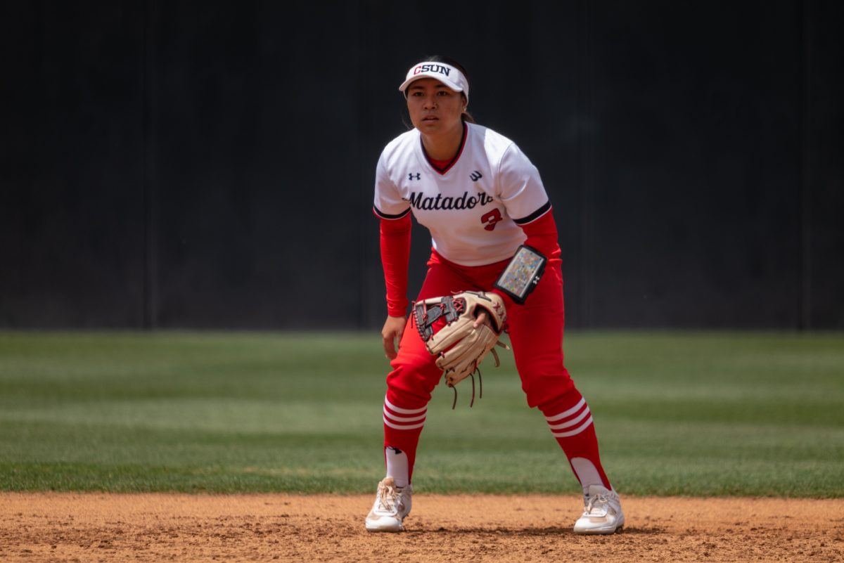 File photo. CSUN softballs infielder Carys Murakami, 3, readies herself before a pitch during their game against UC Davis on Friday, April 14, 2023, in Northridge, Calif.