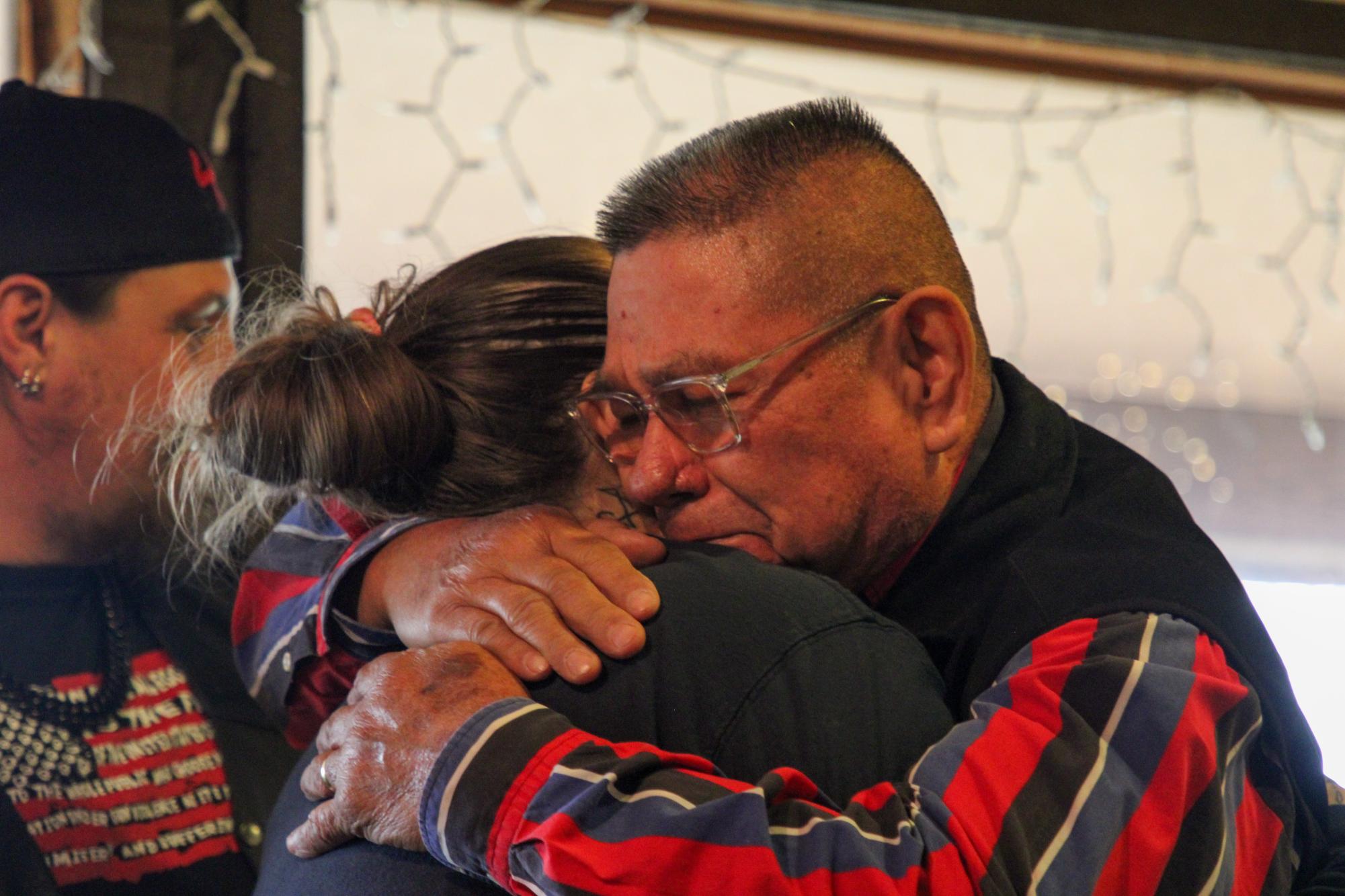 Pastor Meyers hugs Nikki Cross, mother of Uziyah Garcia.