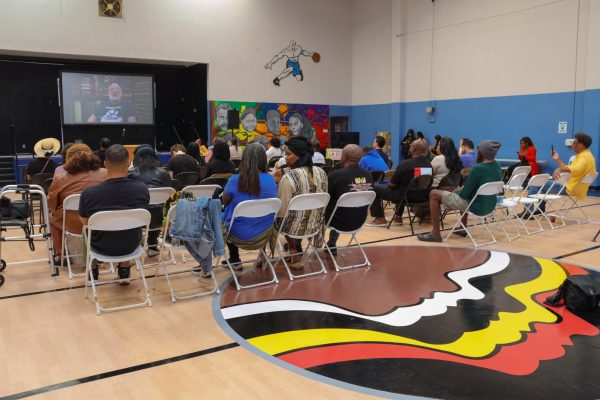 Los Angeles residents watch a video presented by Los Angeles Civil Rights for Juneteenth Black Experience Study event.
