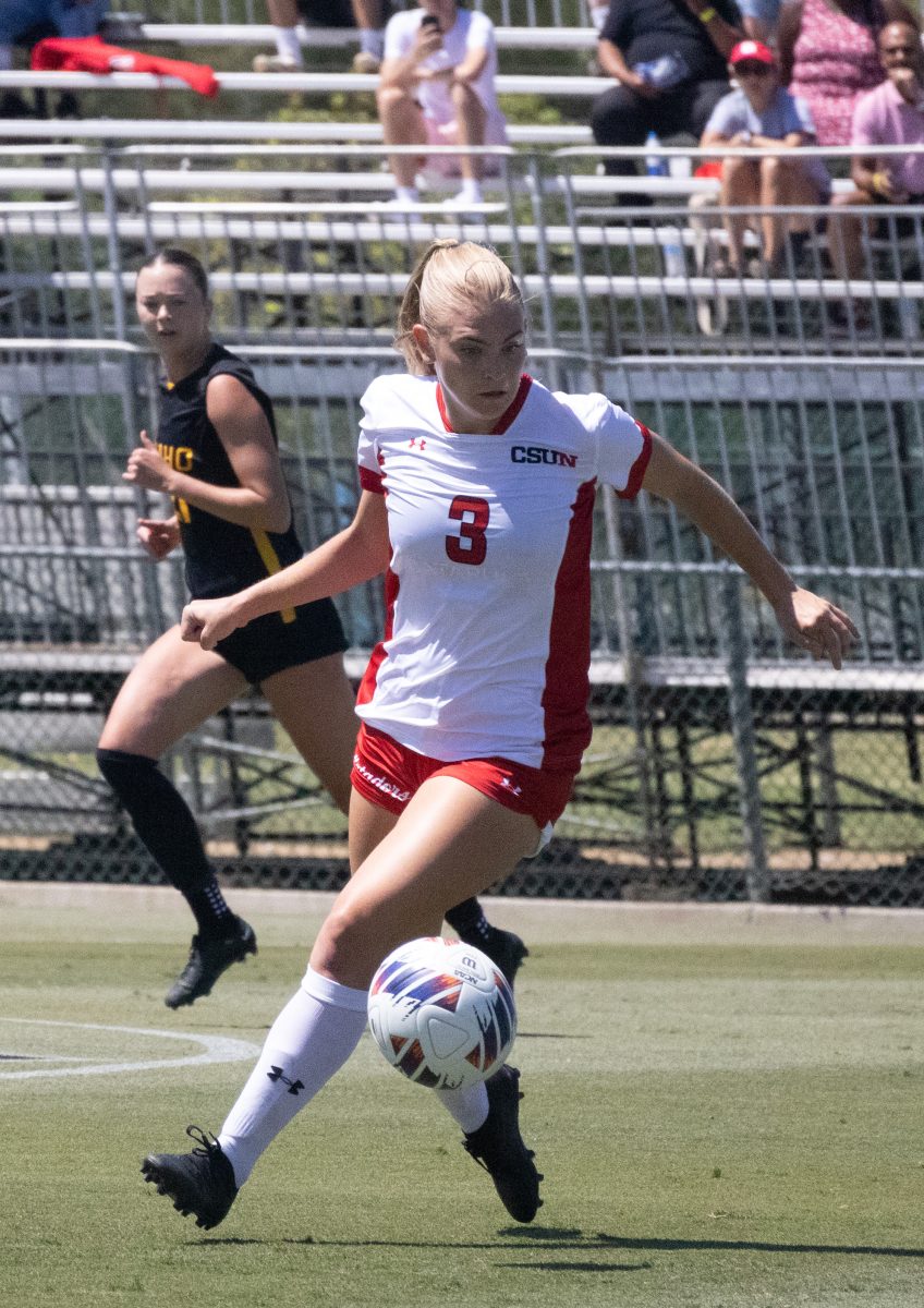 CSUN senior midfielder Brooklin Woolf, 3, keeps the ball running in their home match opener against the University of Idaho on Thursday, Aug. 23, 2024, in Northridge, Calif.