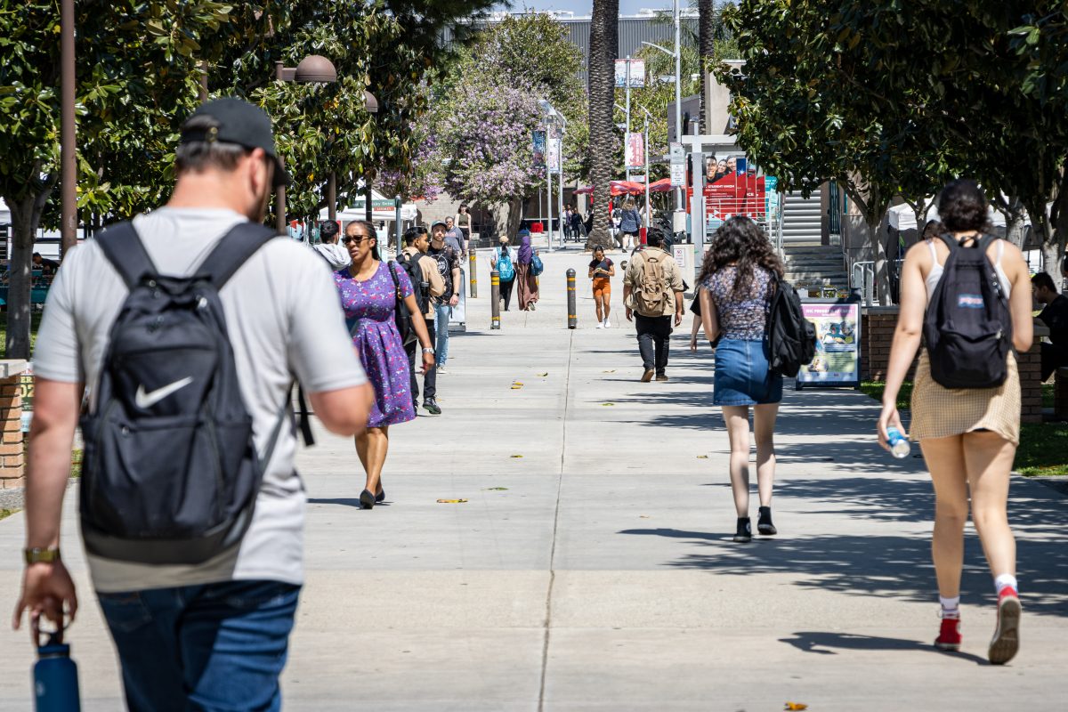 Students walking around Matador Square during the Farmer's Market in Northridge, Calif., on Tuesday, April 30, 2024.