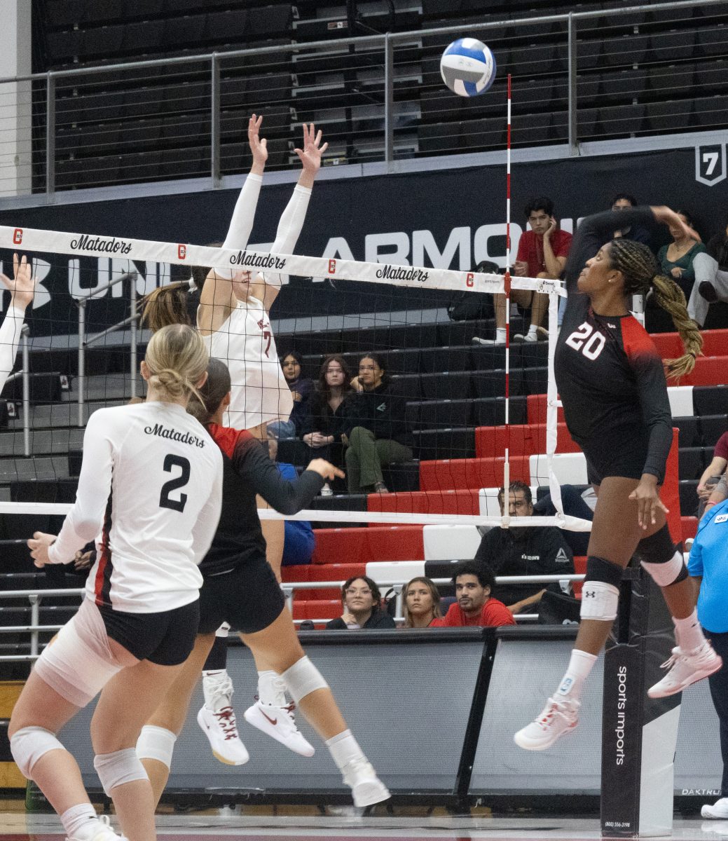 CSUN redshirt sophomore middle blocker Iye Okolo, 20, makes a hard hit on the ball against Washington State University on Thursday, Sept. 19, 2024, at the Premier America Credit Union Arena.