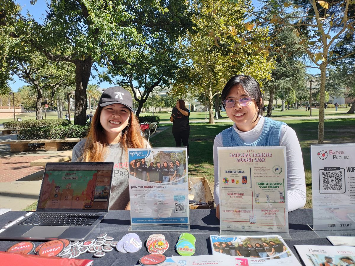 From left, Amber Bui and Drestine Leogo, who were helping students and sharing resources for National Transfer Student Week on the afternoon of Tuesday, Oct.22.