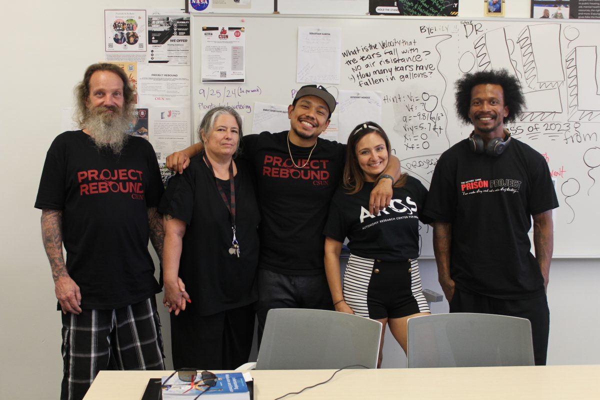 (Left to Right) Lead Intern Garret Eiferman, Student Success Coordinator Maygin Ewen, Intern Miller Alas, Student Crystal Valdez and Intern Julius Maxwell in the Project Rebound study room in Sierra Hall 382.