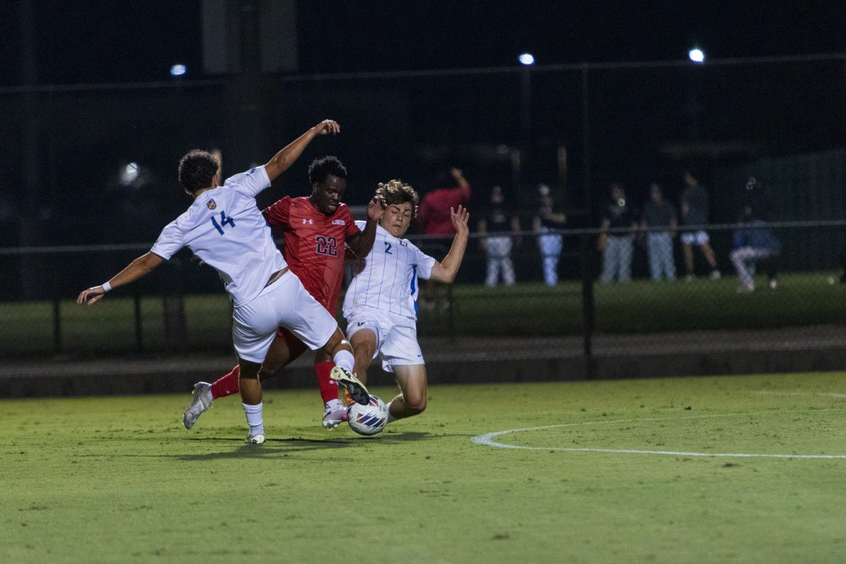 CSUN Men's Soccer Midfielder Boniface Fatohou leads the ball past two UC Riverside defenders, at the Matador Soccer Field on Oct. 2nd, 2024.