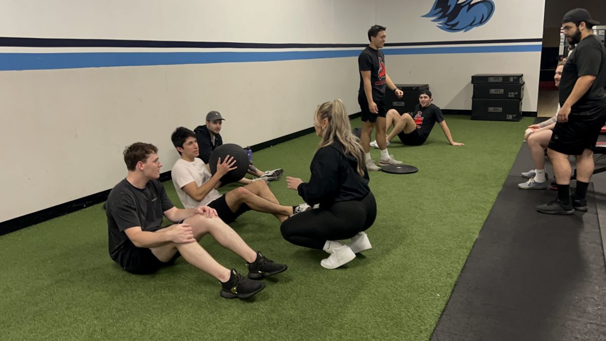 Lola Mormino, CSUN’s Strength & Conditioning Ice Hockey Coach, working with players.