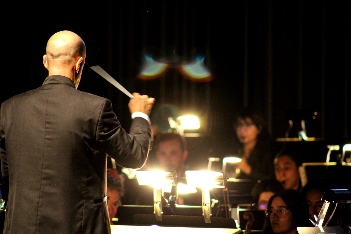 Conductor, John Roscigno, leading the orchestra 