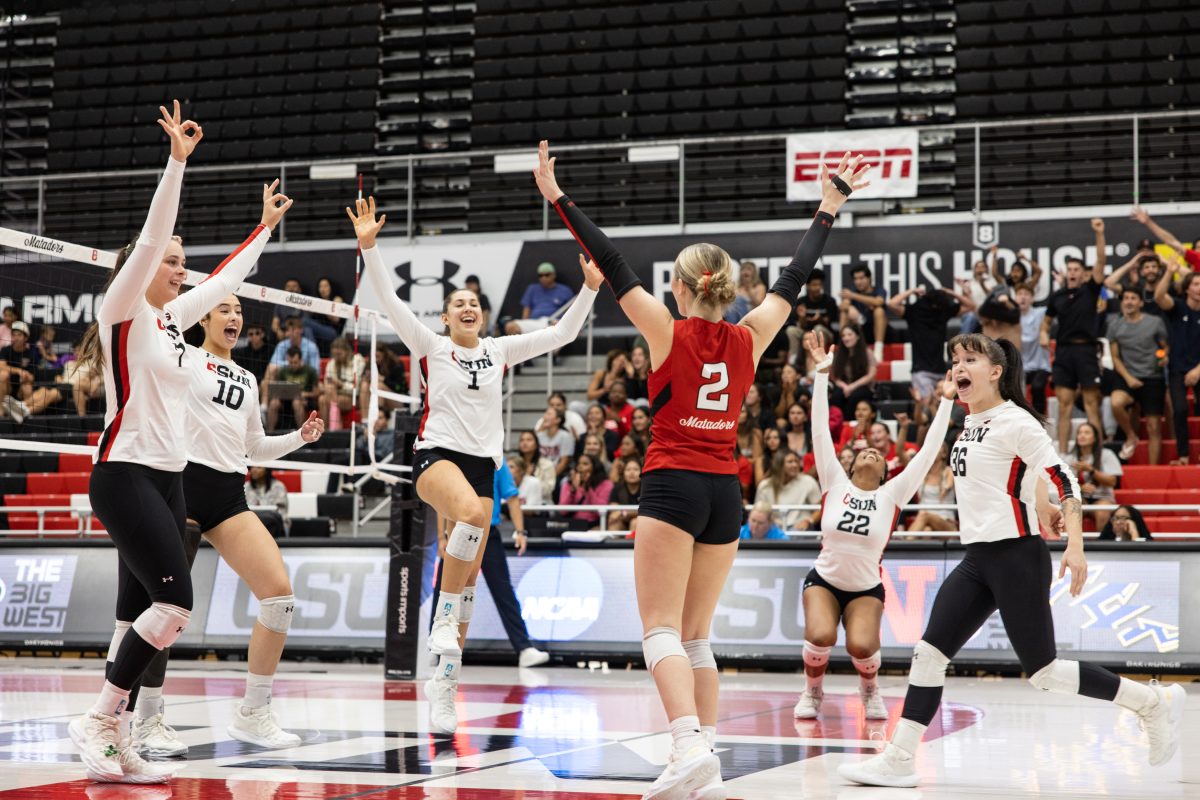 The Matadors celebrate after libero Paige Sentes, 2, serves the ball over the net to score against UC San Diego at the Premier America Credit Union Arena in Northridge, Calif. on Saturday, October 12, 2024.  