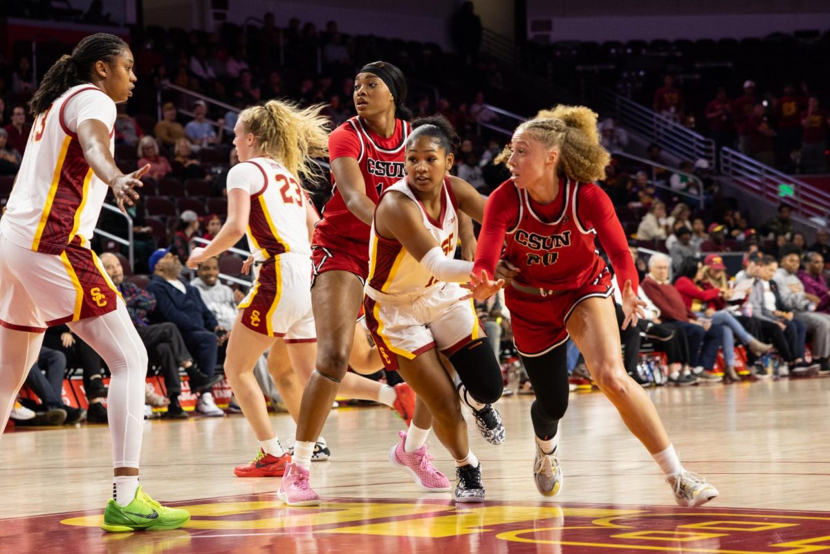 Left to right: USC women's basketball forward-center Rayah Marshall, 13, and guard Avery Howell, 23, defend against CSUN women's basketball players as CSUN forward Nnenna Orji, 14, makes a screen for guard Erica Adams, 20, to get the ball which is being guarded by Malia Samuels, 10, on Tuesday, Nov. 12, 2024, at the Galen Center in Los Angeles, Calif.