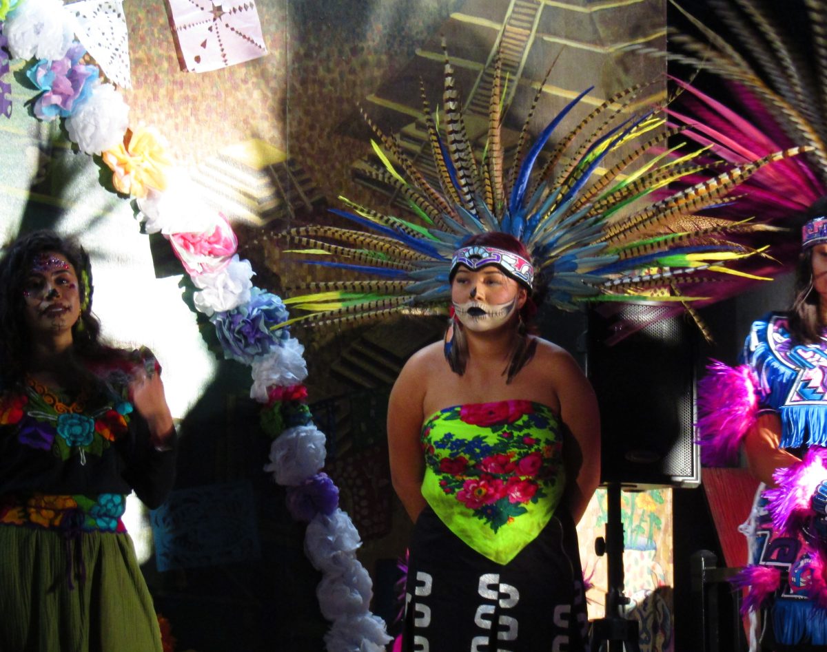 Member of Kalpulli Tlahhuicole stands in a line with other members after performing at Dia de los Muertos event on Nov. 1, 2024