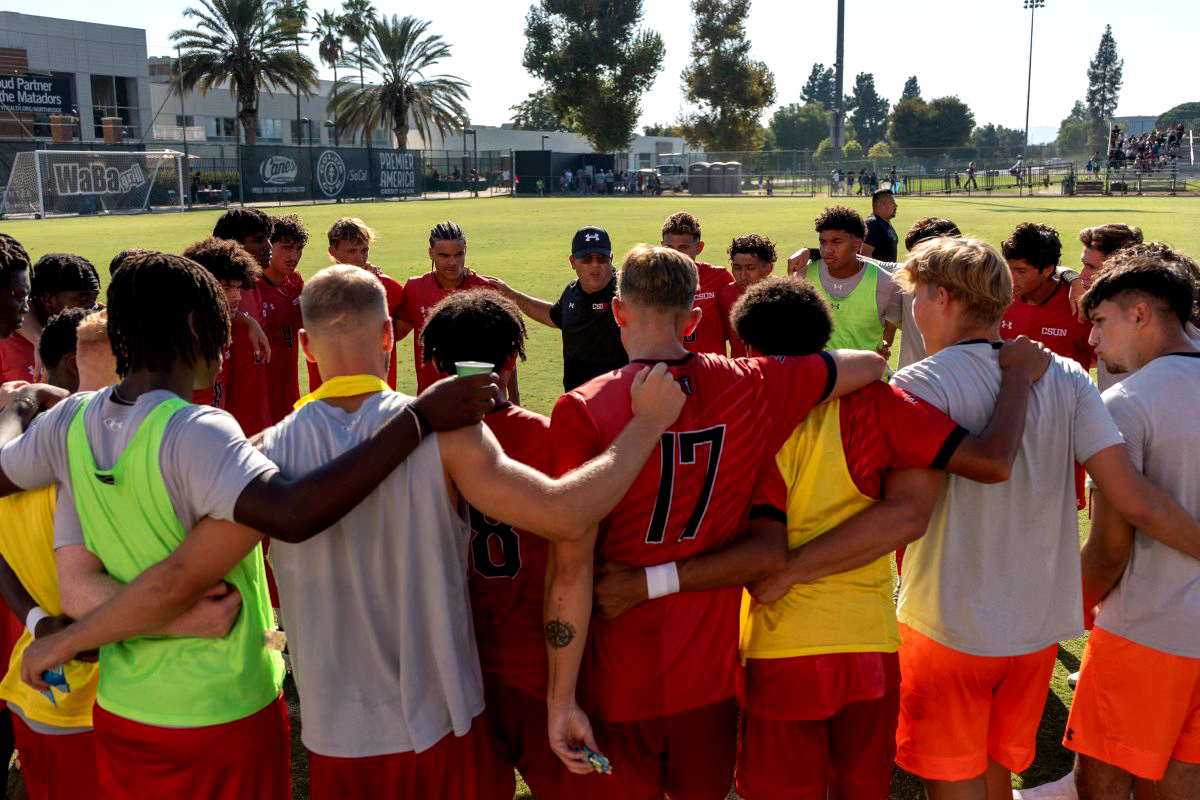 File Photo: The CSUN men’s soccer team huddles while Coach Terry Davila talks to them at Performance Soccer Field on Sunday, Sept. 22.