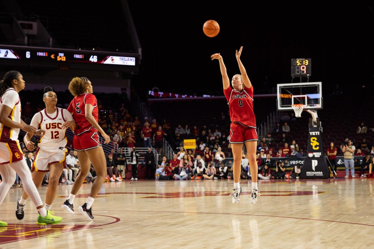 Left to right: USC's forward center Raya Marshall, 13, and guard JuJu Watkins try to defend as CSUN center Yves Cox, 5, sets a screen on Watkins, leaving guard-forward Jenna Kiltly, 0, open to shoot at the three-point line on Tuesday, Nov. 12, 2024, at the Galen Center in Los Angeles, Calif.