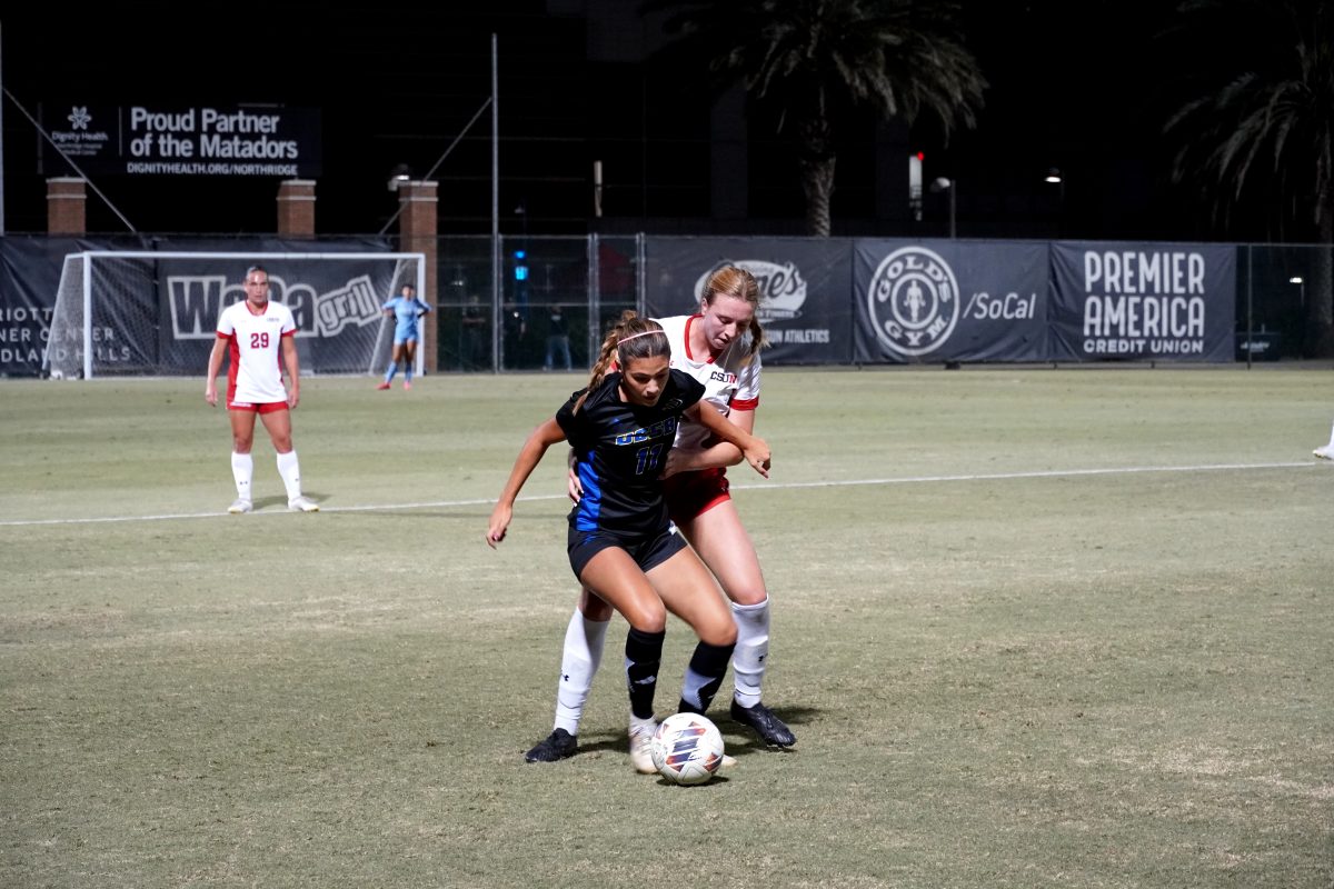 CSUN defender #4 Paige Califf attempting to win the ball back from UC Santa Barbara forward #11 Haley Philips during their match on Oct. 20, 2024.