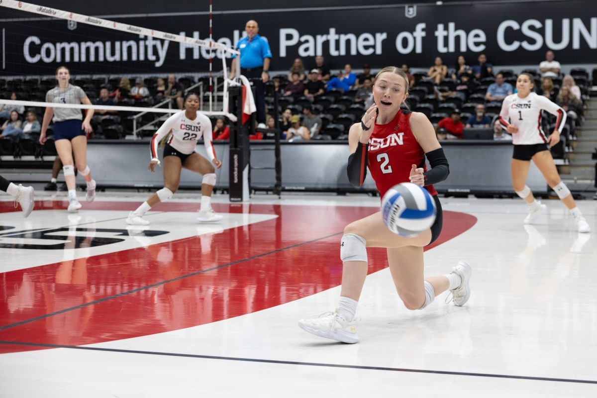 Libero Paige Sentes, 2, sees the ball is out, scoring against UC San Diego on Saturday, October 12, 2024, at the Premier America Credit Union Arena in Northridge, Calif.