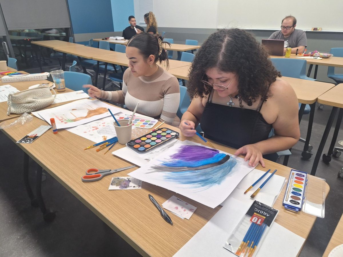 Heaven Calderon (left) and Stephanie Perez (right) enjoy the quietness and relaxing environment of the classroom at the Peacebuilding Through Art-Making Event on Dec. 3 in the Maple Hall at CSUN. Despite Perez not being a student, she expressed her appreciation for the arts and enjoyed spending time with her friend. 