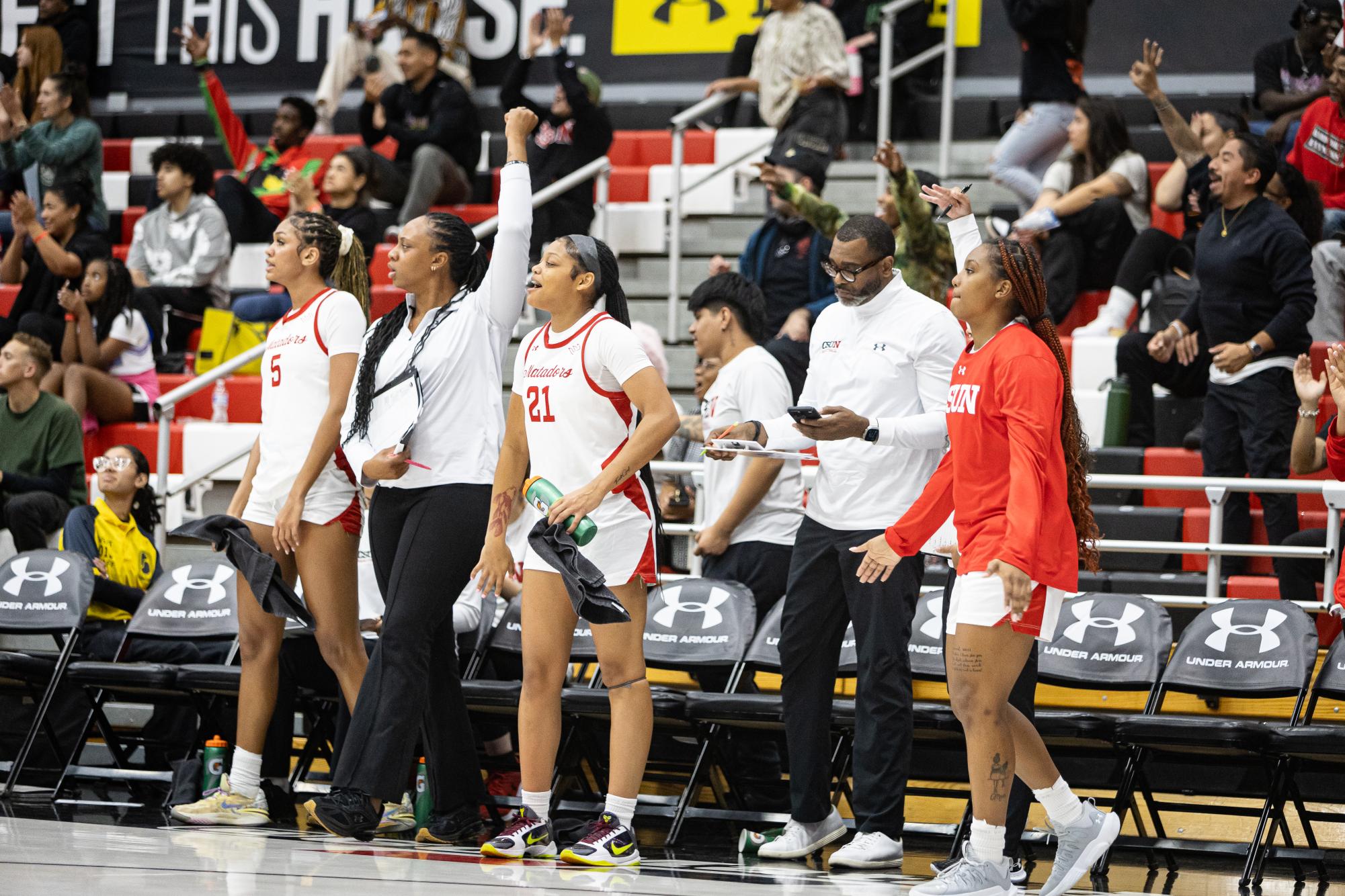 The Matador bench celebrates after a made three at the Premier America Credit Union Arena in Northridge, Calif., on Nov. 27, 2024. The Matadors shot 46 percent from behind the arc.